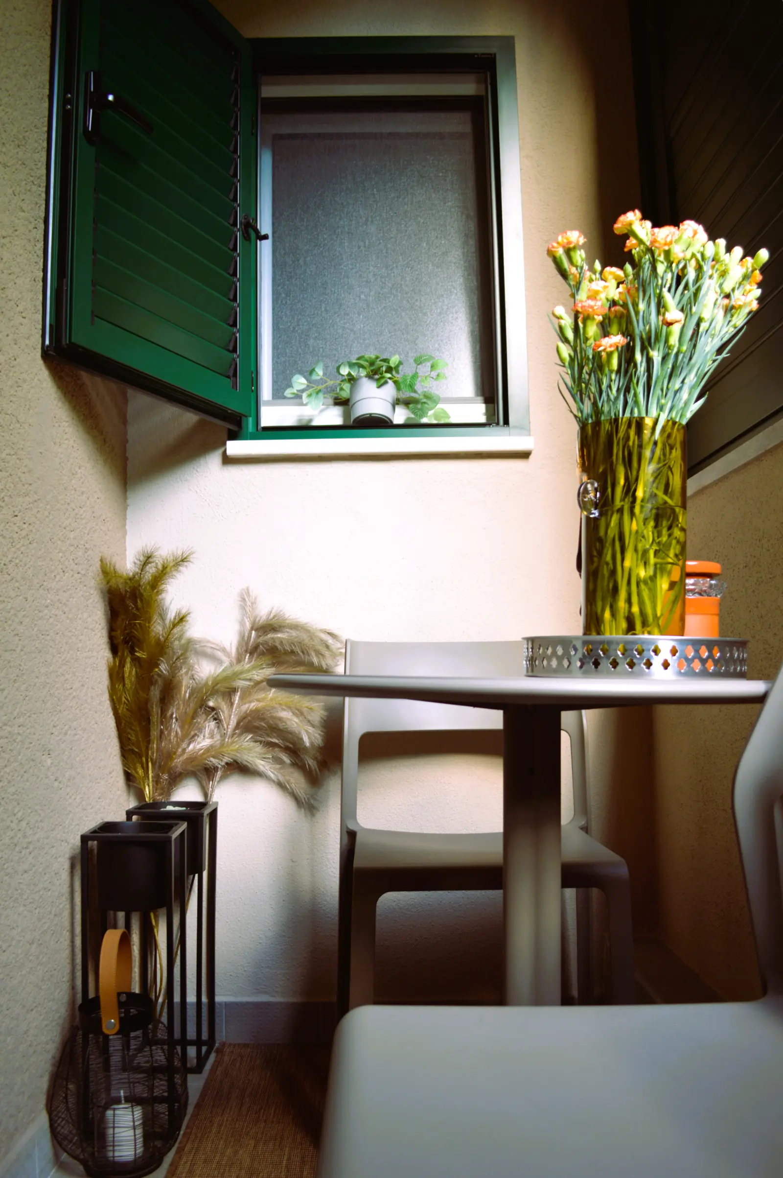 A table with flowers on the balcony
