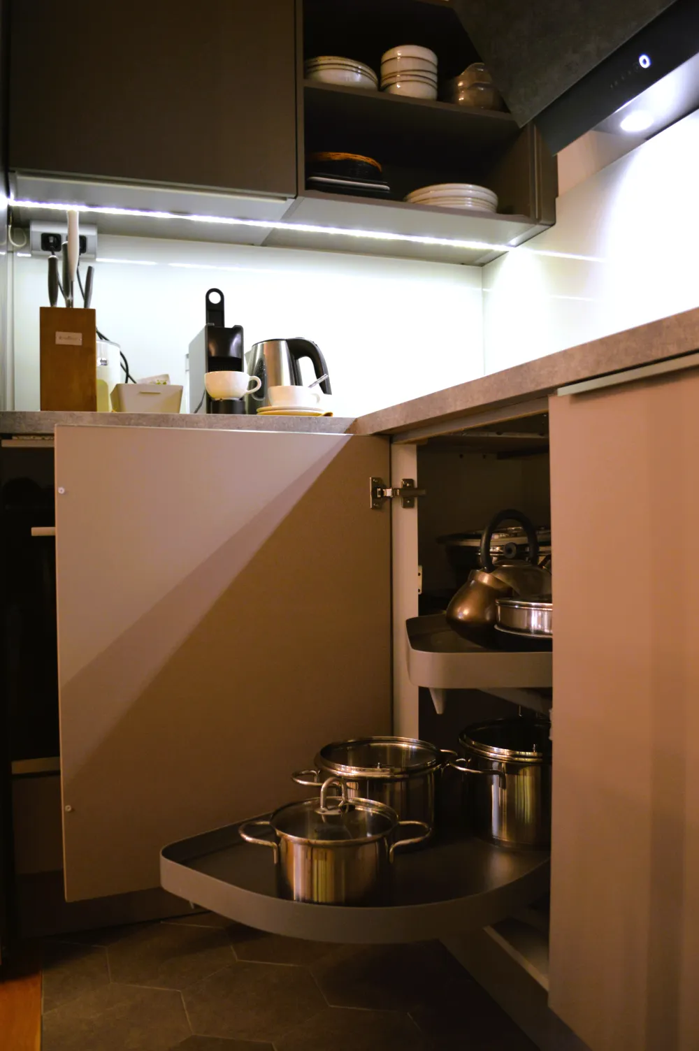 Open shelves of cookware in the kitchen